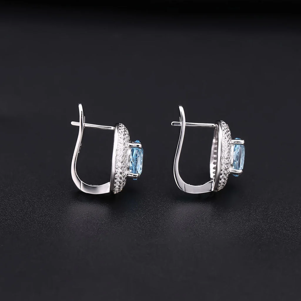 Opulent Blue Topaz Halo Clear Cubic Zirconia Cluster Stud Earrings - Image 3