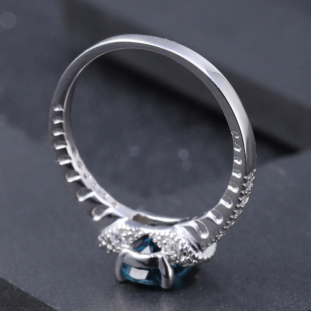 Opulent Clear Cubic Zirconia London Blue Topaz Halo Ring - Image 4