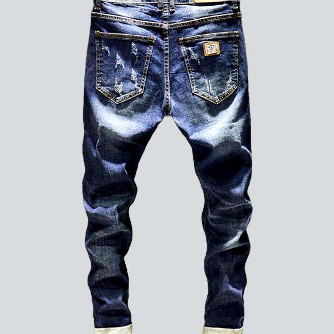 Whiskered distressed jeans for men - Image 3